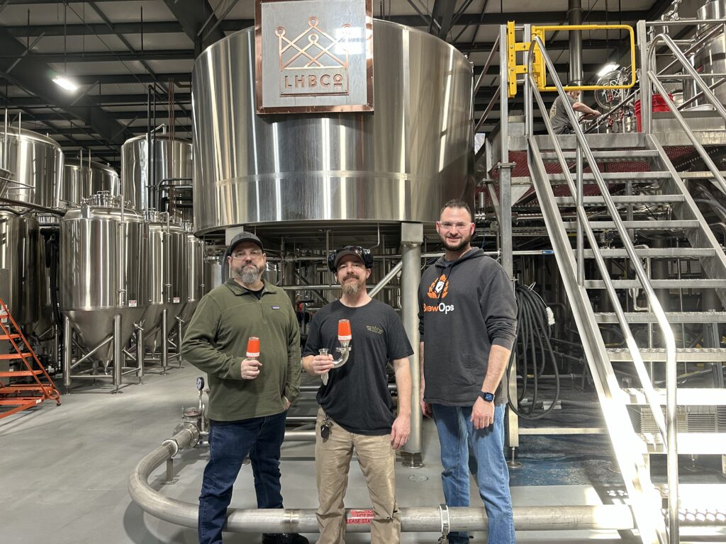 Lord Hobo Brewing Company uses BrewOps sensors to provide them with “peace of mind.” Brew Master Keith Gabbett, Maintenance Manager John Irwin, and BrewOps’ Aaron Ganick.